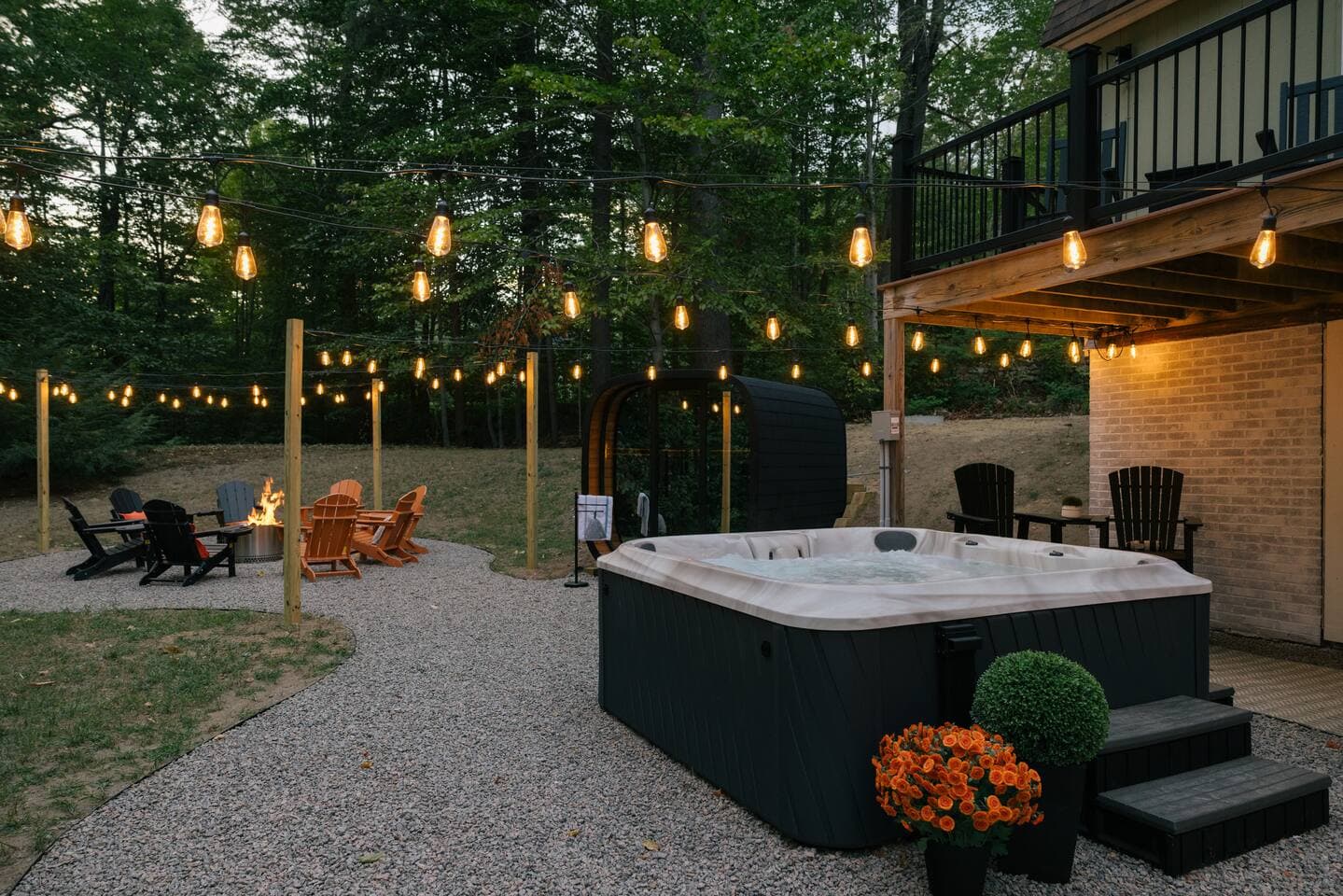 Seven-person hot tub, cedar barrel sauna and fire pit beside the deck